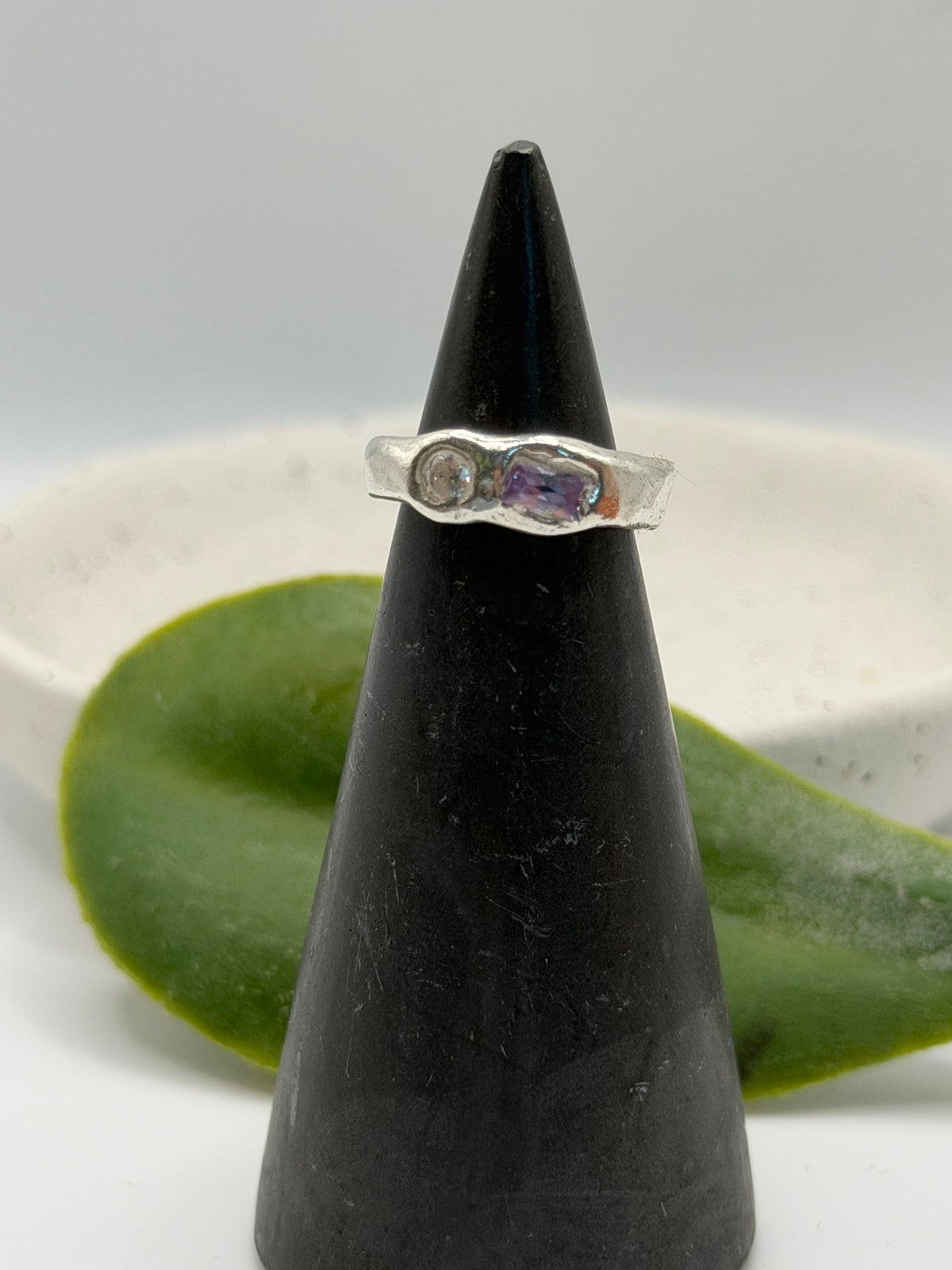 One-of-a-kind 999 fine silver ring from the Stone + Silver collection, featuring lavender-coloured and clear cubic zirconia gemstones set in a handcrafted design.