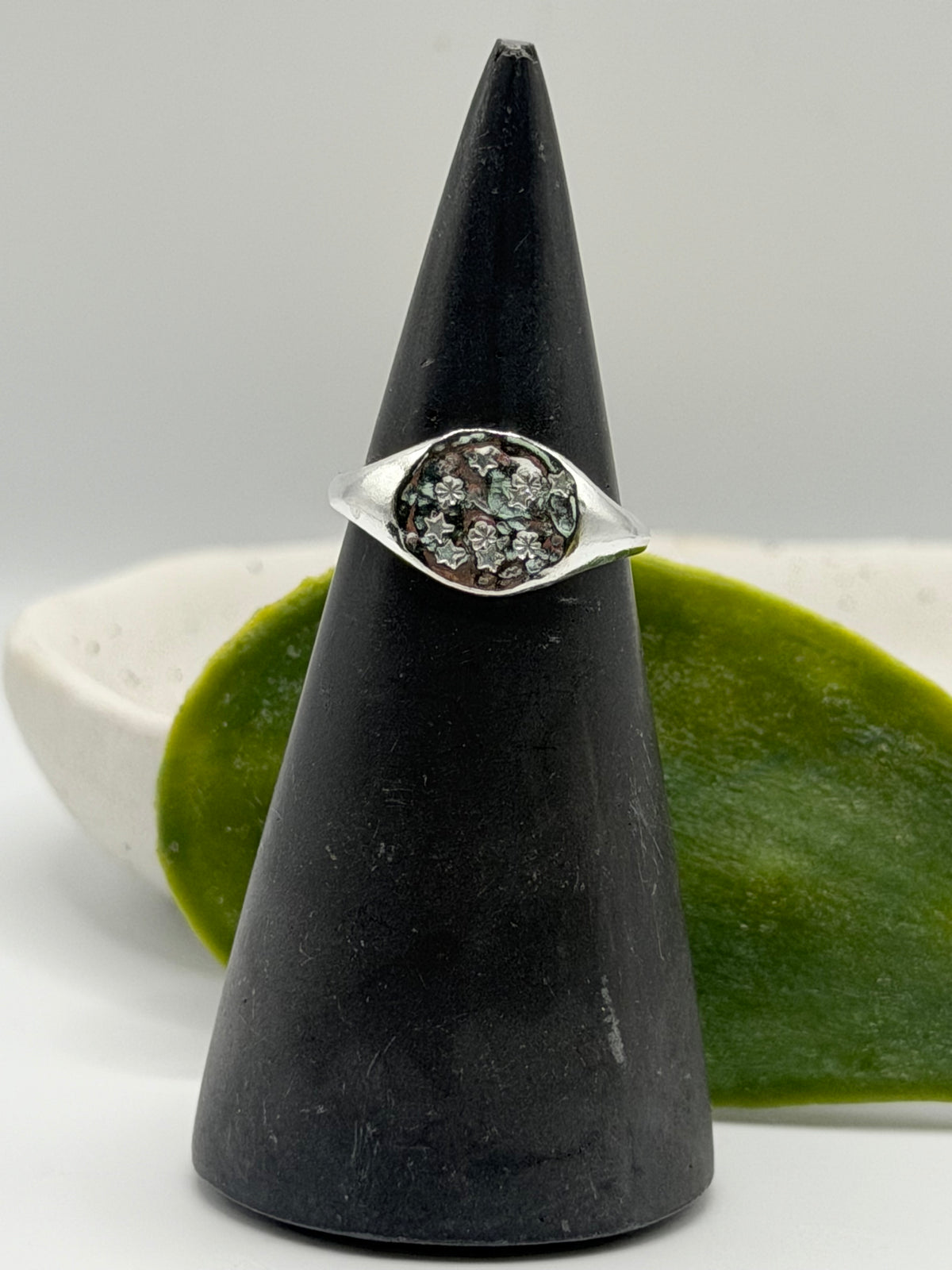Handmade recycled sterling silver Galaxy Signet Ring featuring a circular dimple-textured face with tiny scattered star details, crafted in small batches by independent silversmith Wild One Jewellery in Lincolnshire, UK.