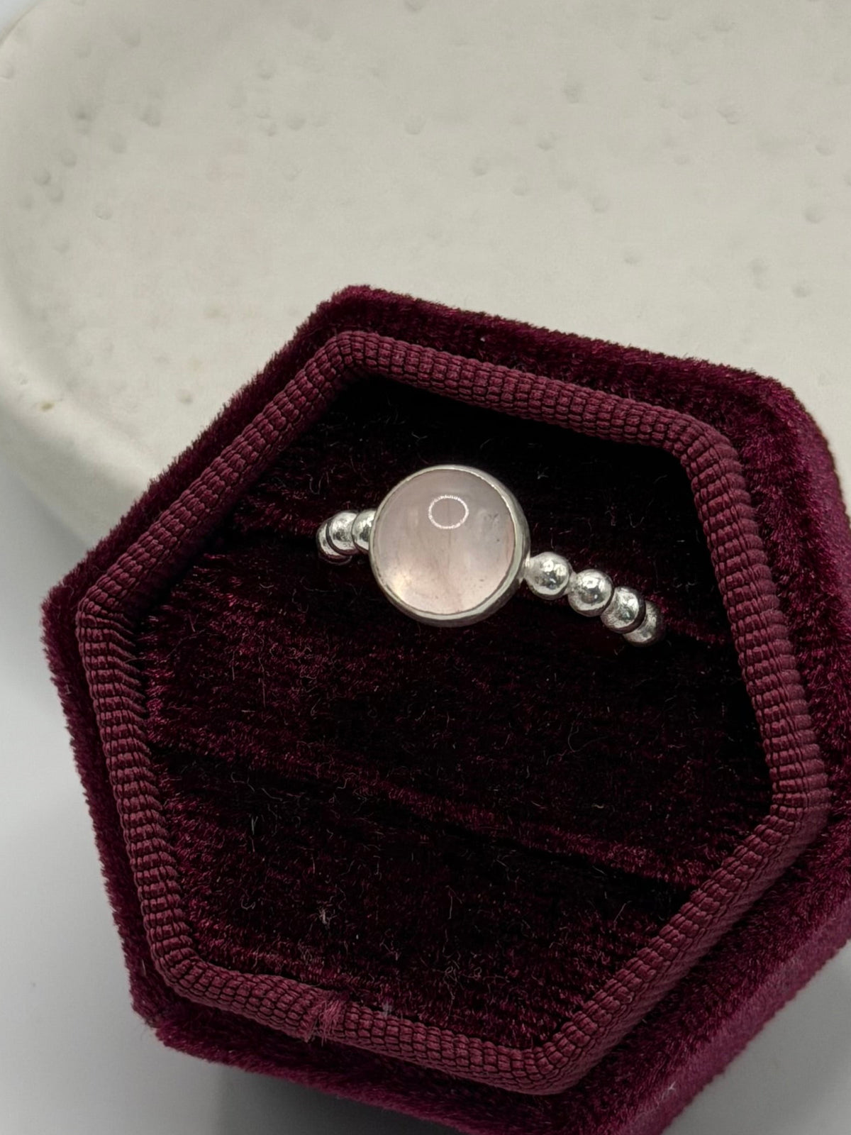 One-of-a-kind round rose quartz bobble ring from the Stone + Silver collection by Wild One Jewellery, featuring a pale pink rose quartz cabochon set in a sterling silver band with decorative silver bobble details.