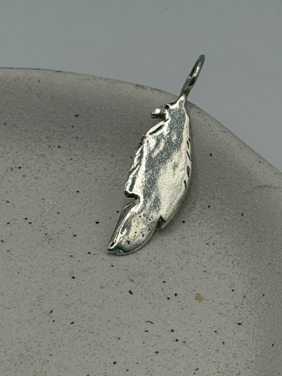 Handmade fine silver Maxi Feather charm with an organic, textured feather design, available with a belcher chain from Wild One Jewellery\.