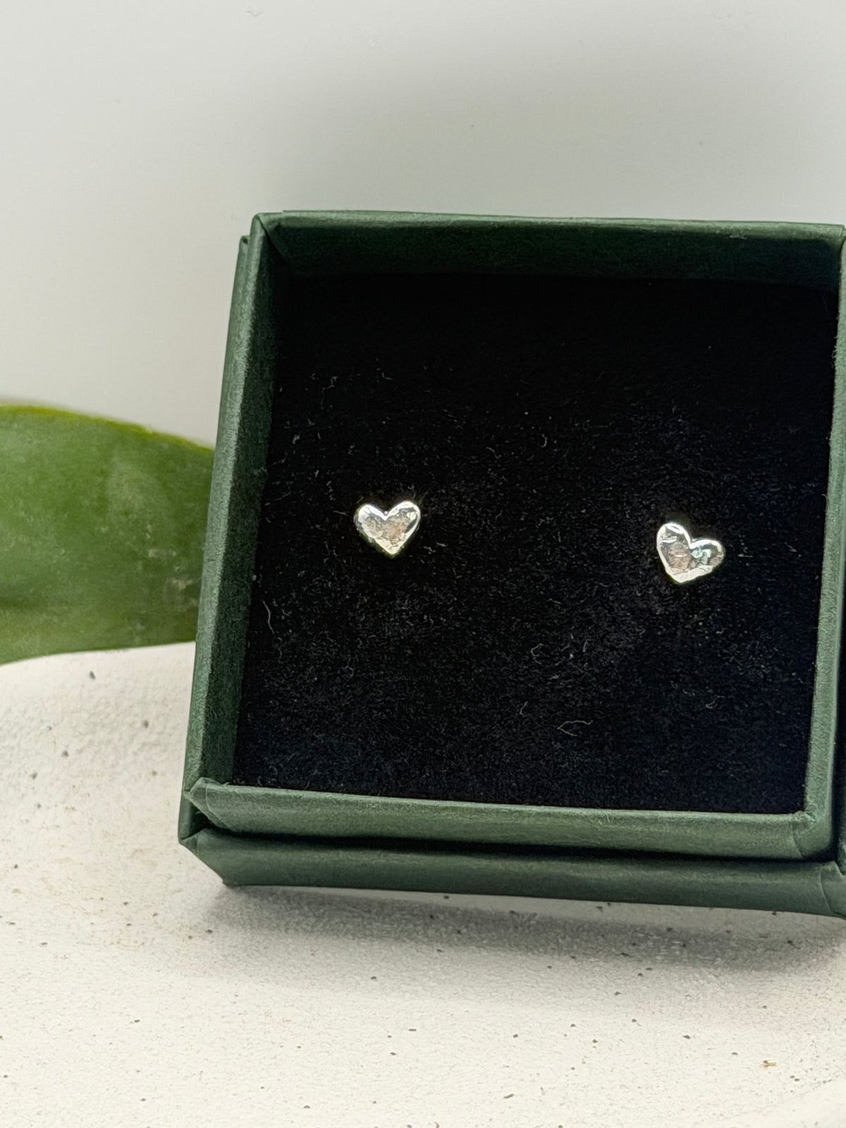 Pair of Love Studs handcrafted from recycled 925 sterling silver with a softly textured heart design.