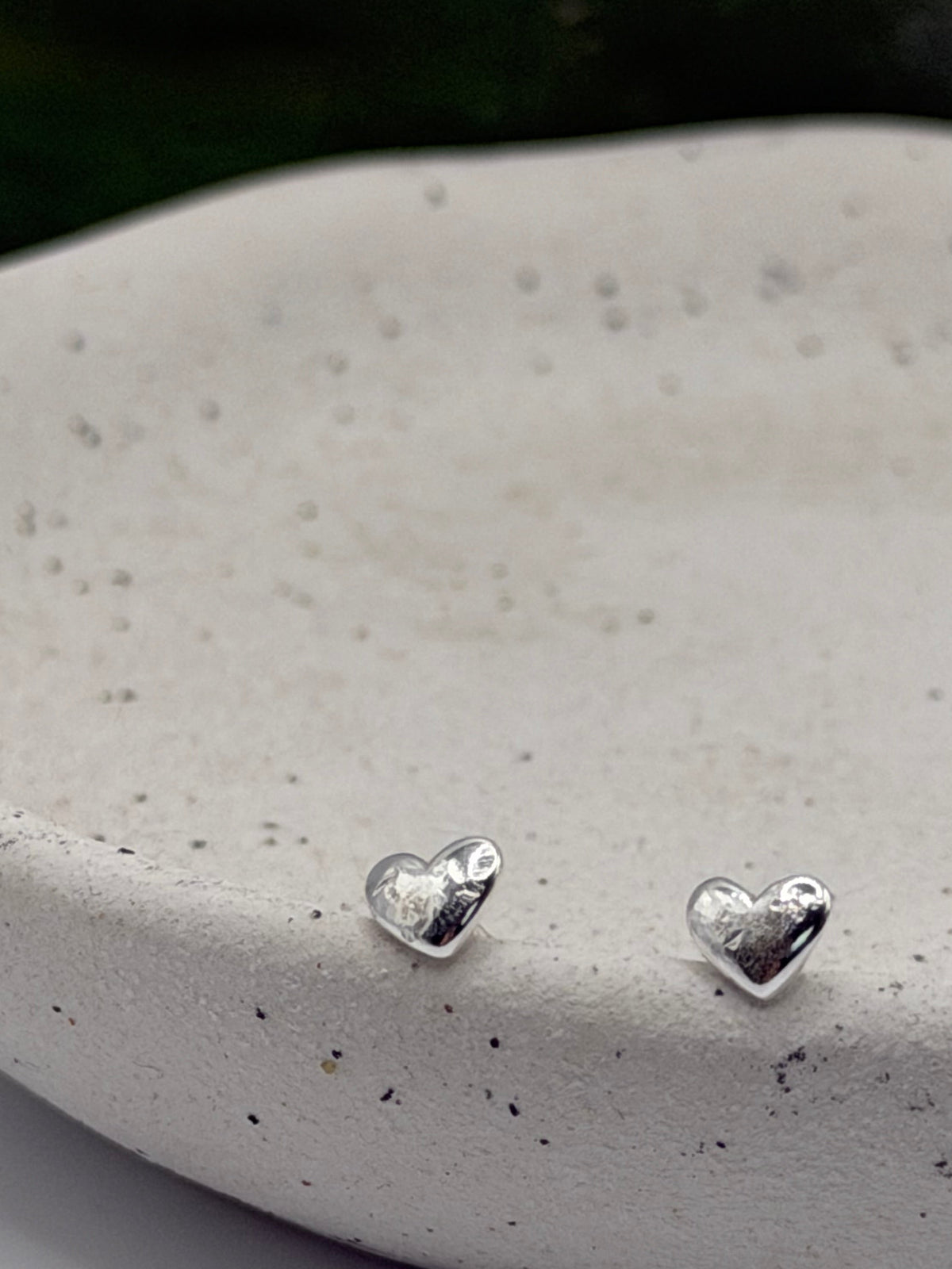 Pair of Love Studs handcrafted from recycled 925 sterling silver with a softly textured heart design.