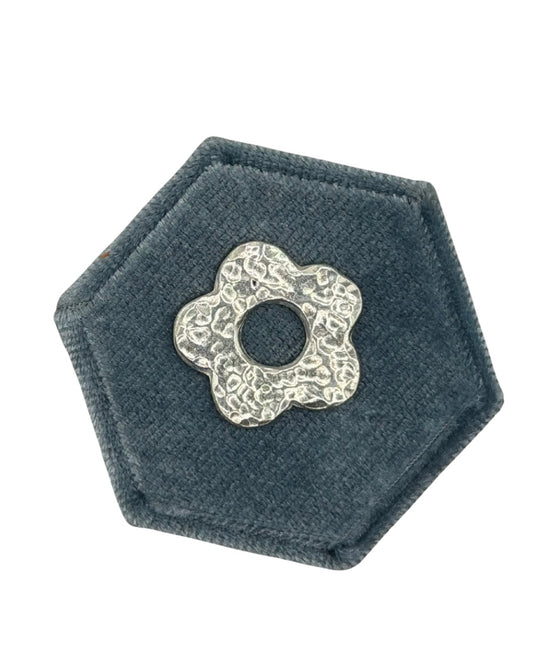 Handmade recycled sterling silver Midi Flower charm featuring five softly rounded petals and a dimple-textured finish, part of the Wild One Jewellery Charm Bar collection.