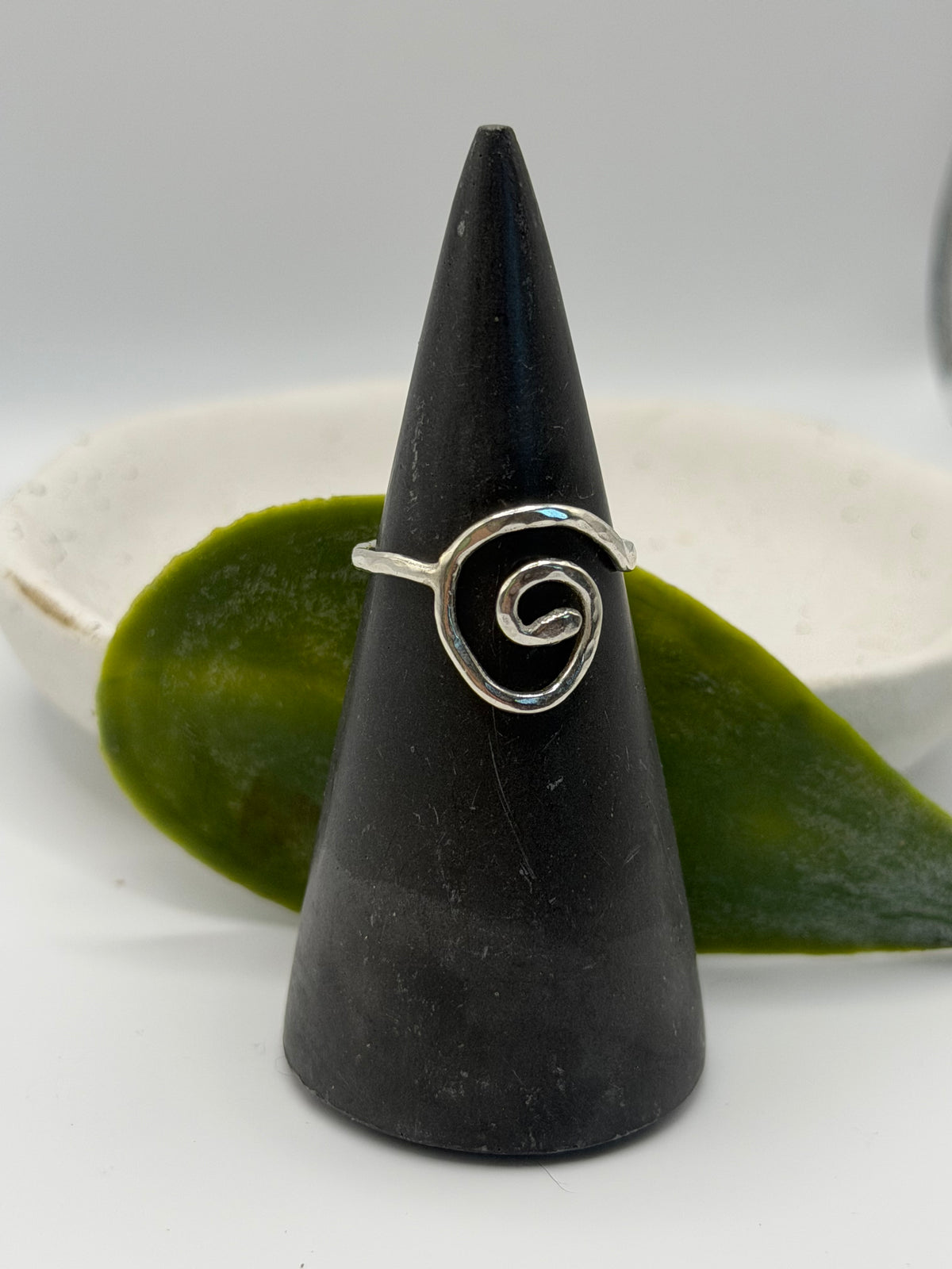Handmade recycled sterling silver spiral ring with an organic swirl design and polished textured finish by Wild One Jewellery, Lincolnshire.