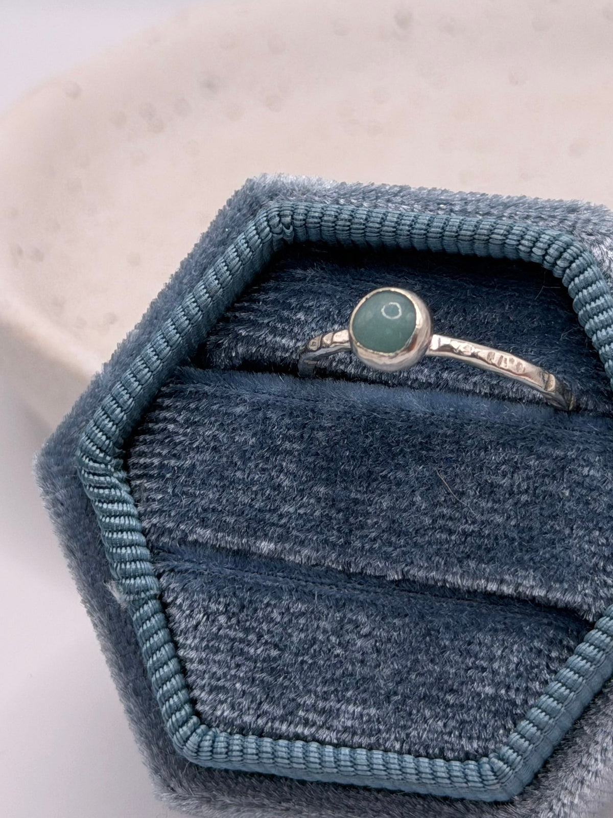One-of-a-kind oval amazonite ring from the Stone + Silver collection by Wild One Jewellery, featuring a blue-green amazonite cabochon with natural markings set in a sterling silver band.