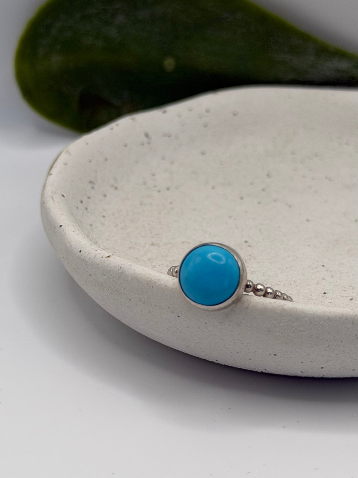 One-of-a-kind turquoise bobble ring from the Stone + Silver collection by Wild One Jewellery, featuring a turquoise cabochon set in a sterling silver band with decorative silver bobble details.